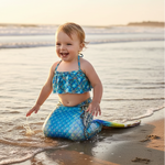 Charger l'image dans la galerie, Child in a mermaid tail playing in the water at the beach
