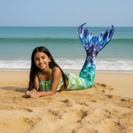 Load image into Gallery viewer, Girl with a mermaid tail lying on the beach