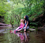 Load image into Gallery viewer, mother and daugher dressed as mermaids sitting by a stream in a forest