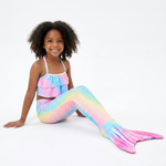 Load image into Gallery viewer, Coco wearing the Pastel Rainbow mermaid tail