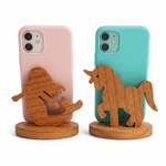 Load image into Gallery viewer, Rear-view preview of mermaid and unicorn phone stands with pink and turquoise phone cases