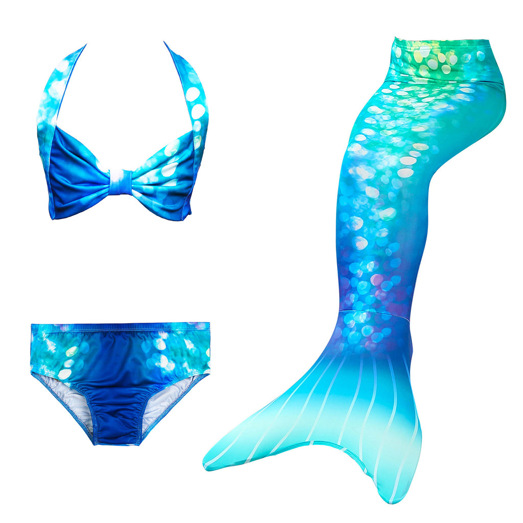 Turquoise Blue Mermaid Tail with photo print, shimmer like effect design. Complete with matching material new shape bikini. Part of our more affordable range, this tail has poppers at the bottom. The monofin can be taken on and off easily without stepping out of the whole tail. Mini Mermaid Tails