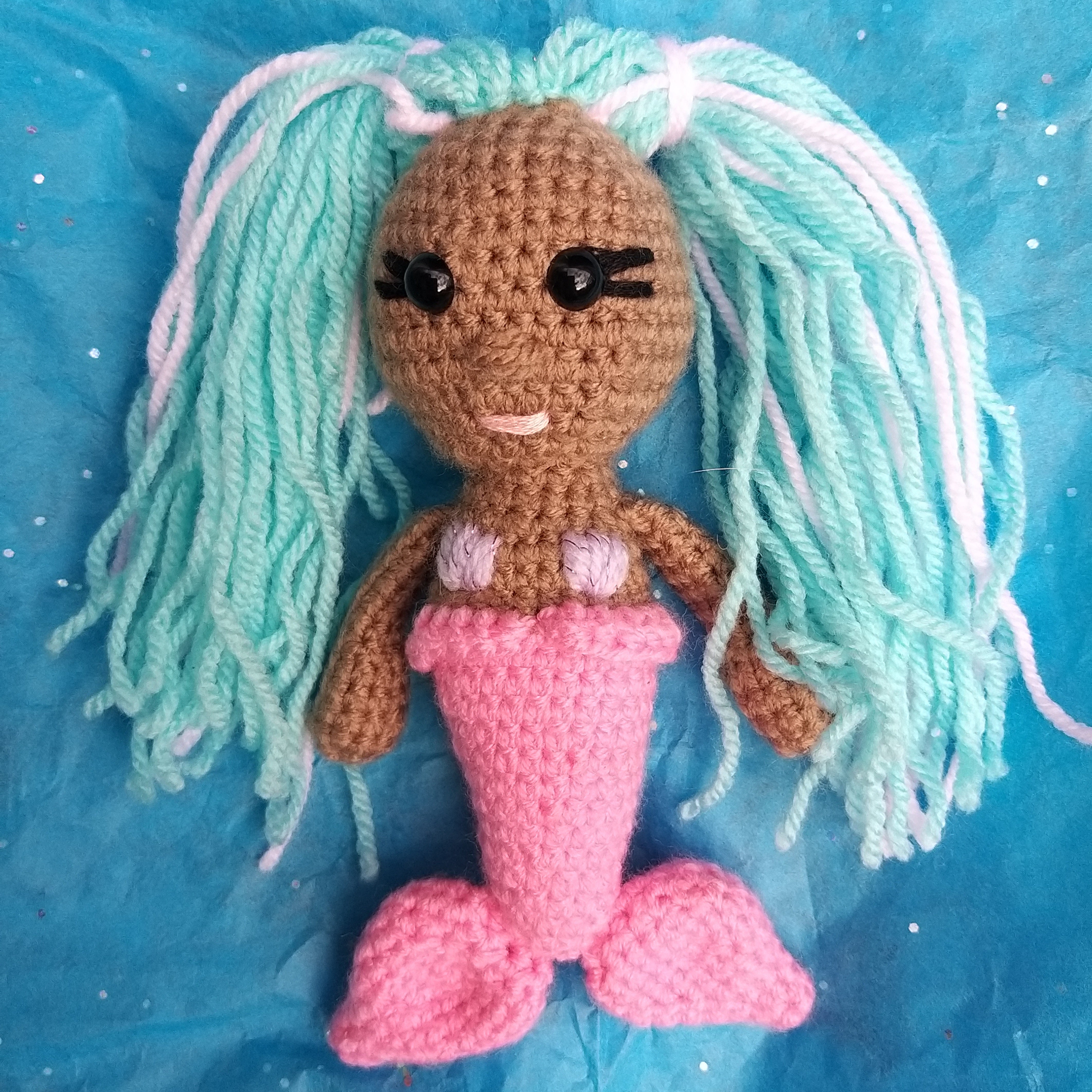 Adorable crocheted mini mermaids toy key rings in pink and teal with hair you can style, varying colored hair, skin and mermaid tails. Mini Mermaid Tails