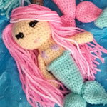 Load image into Gallery viewer, Adorable crocheted mini mermaids toy key rings in pink and teal with hair you can style, varying colored hair, skin and mermaid tails. Mini Mermaid Tails
