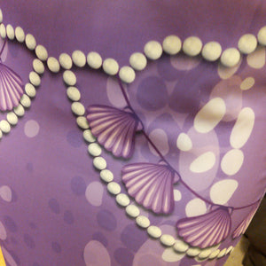 This is a close up of the intricate work done on the Purple Shell Mermaid Tail. Mini Mermaid Tails