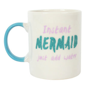 Bone china mug for adult mermaids, white with teal handle, says "Instant Mermaid (in teal colored glitter) just add water" with pink lettering. Mini Mermaid Tails