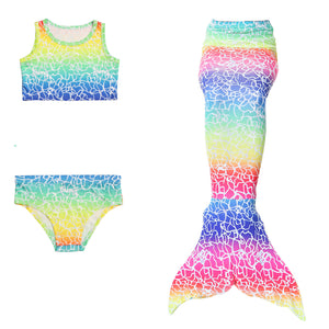 Adorable Bright Rainbow Mermaid Tail with white crackle printed effect. Matching material tankini that looks great as a crop top with jean shorts.  Part of our more affordable range, this tail has poppers at the bottom. The monofin can be taken on and off easily without stepping out of the whole tail. Mini Mermaid Tails