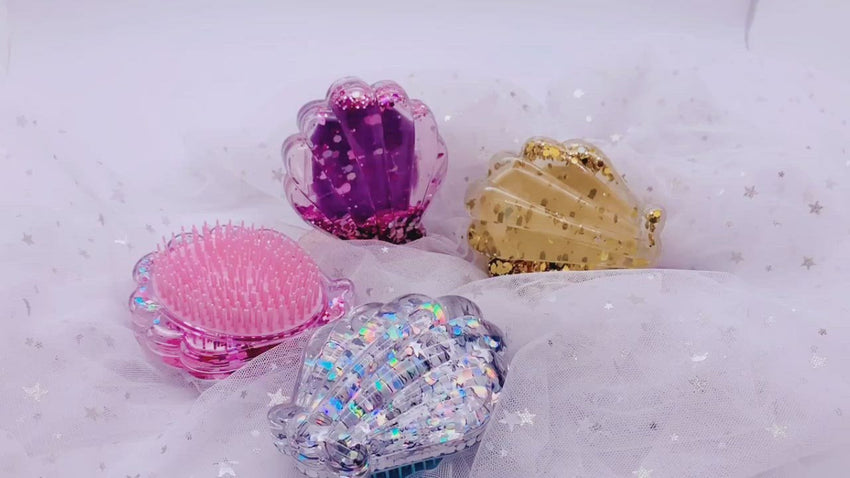 Cute video showing the pink, purple, blue, and gold sparkly glitter detailing hairbrush. Shake and wake up the dreamy undersea world and watch the fascinating glitter. Mini Mermaid Tails