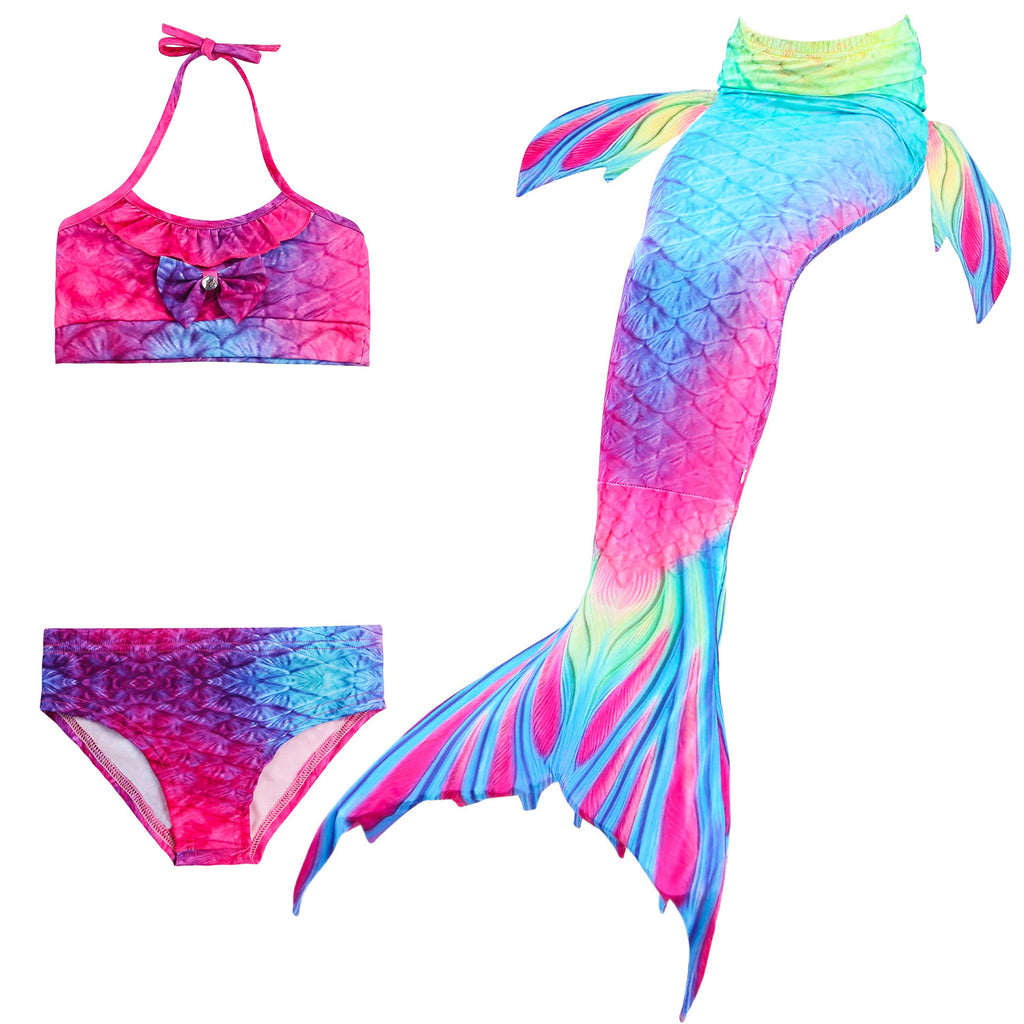 Bold Rainbow Coloured Mermaid Tail with added dorsal fins. Complete with matching material halterneck bikini with cute embellished bow. Part of our luxury range, this tail has a high quality side zip. Mini Mermaid Tails