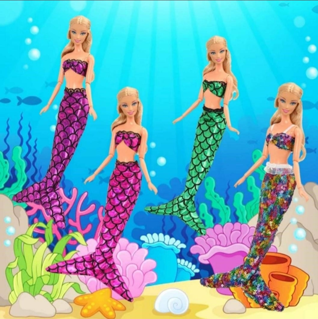 Four Barbie dolls transformed into Mermaids with the Mermaid Tail Set for Barbie like dolls. Set of 6 includes: 4 Tails & bikini tops , 1 Monofin, and 1 Dressing Gown is various colors. Mini Mermaid Tails