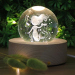 Load image into Gallery viewer, Mermaid Crystal Ball 3D LED Nightlight set on a wooden base. Mini Mermaid Tails
