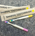 Load image into Gallery viewer, Bamboo toothbrushes in assorted pastel colors, FFBEAT packages. BPA free, charcoal infused. Mini Mermaid Tails 

