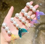 Load image into Gallery viewer, Pastel colored Mermaid Tail Beach Hair Clips with different colored tails and a line of pearls. Mini Mermaid Tails

