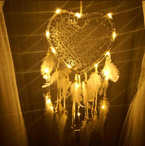 Beautiful, heart shaped Dream Catcher with LED Lights, turned on and shining. Feather White. Mini Mermaid Tails