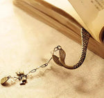 Load image into Gallery viewer, Mermaid Tail bookmark with charm coming out of a book. Mini Mermaid Tails
