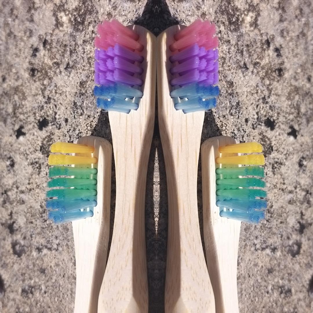Bamboo toothbrushes in assorted pastel colors.  BPA free, charcoal infused. Mini Mermaid Tails