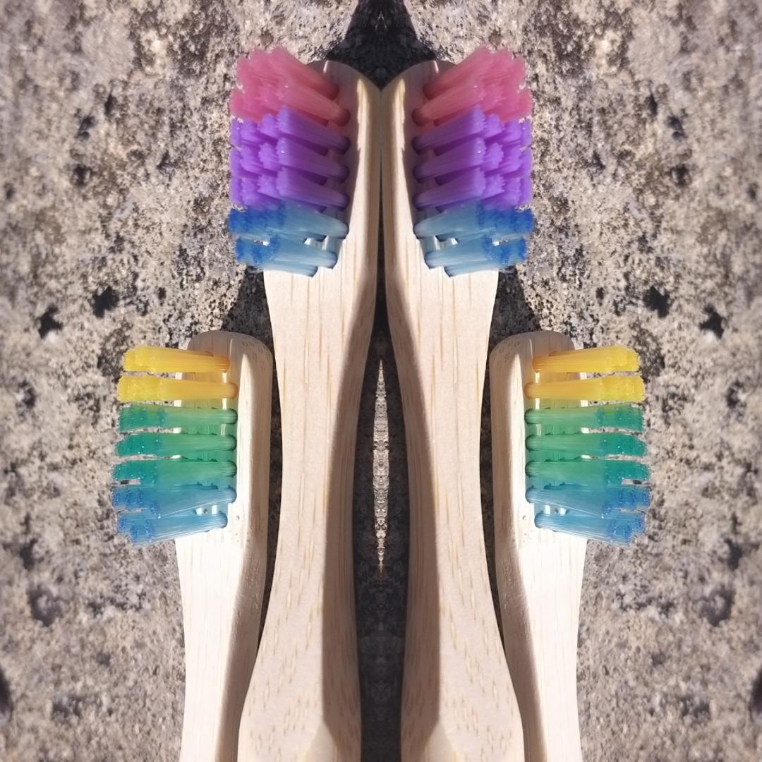 Bamboo toothbrushes in assorted pastel colors.  BPA free, charcoal infused. Mini Mermaid Tails