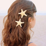 Load image into Gallery viewer, Pretty pair of Starfish Hair Clips.  Great for creating a boho, beachy look or for completing your little mermaid&#39;s look.  These are natural, sustainably sourced products. Mini Mermaid Tails
